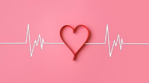 Heart illustration over a pink background